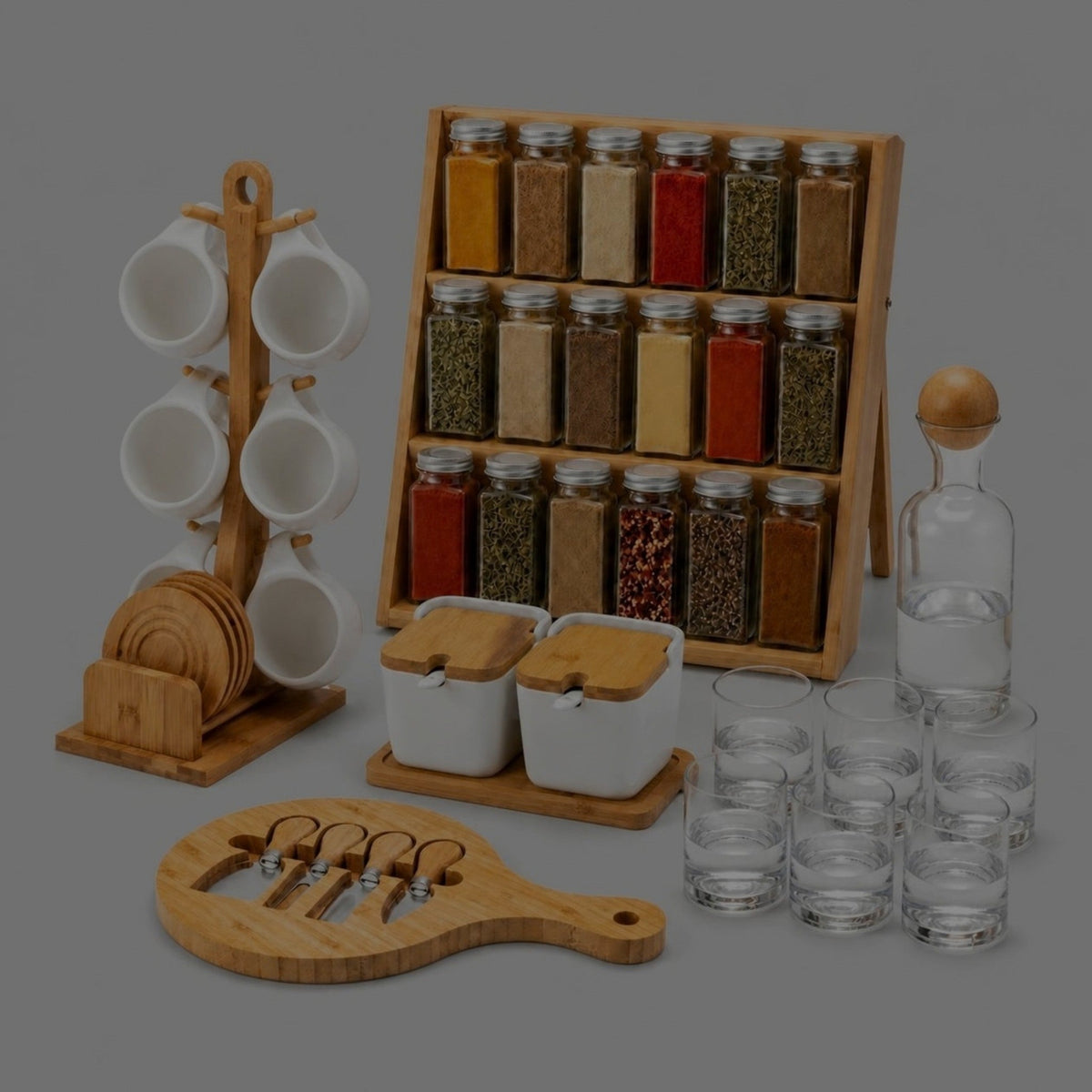 Bamboo spice rack with 18 filled glass jars, white tea cups on a bamboo mug stand, white canisters on a bamboo tray, glass carafe with six cups and a round bamboo cheese board with knives
