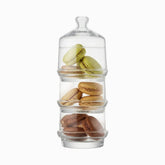3-tier stackable glass jar with knob lid holding green, beige and brown macarons