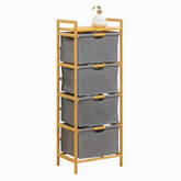 Tall bamboo shelf with 4 grey fabric drawers and a small white vase with a plant on top