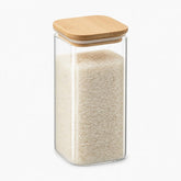Tall square glass storage jar with bamboo lid filled with rice