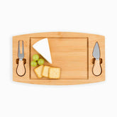 Rectangular bamboo cheese board with a brie wedge, green grapes and crackers, fork and knife stored in side slots