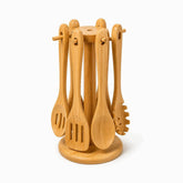 6 bamboo cooking utensils hanging on a round bamboo carousel stand