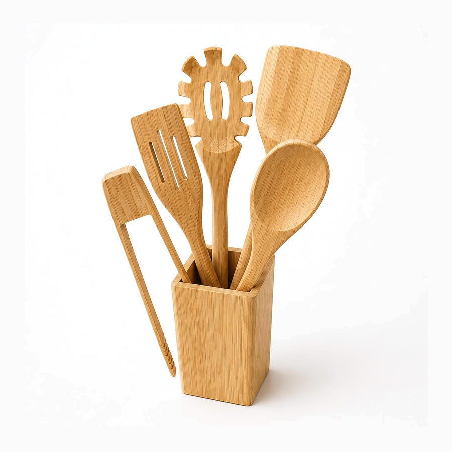 5 bamboo cooking utensils standing in a square bamboo holder