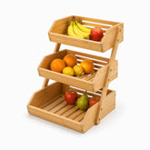 3-tier bamboo fruit basket stand with bananas, oranges, lemons, apples and a pear on slatted shelves