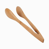 Bamboo serving tongs with spoon-shaped heads, slightly open