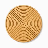 Round bamboo board with 12 circular ring grooves, top view