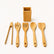 Bamboo tongs, spaghetti server, slotted turner, spoon and flat turner laid out with the holder
