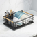 Black dish rack with plates, bowls and utensils on a marble kitchen counter