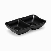 Black matte rectangular sauce dish with 2 sections and small feet