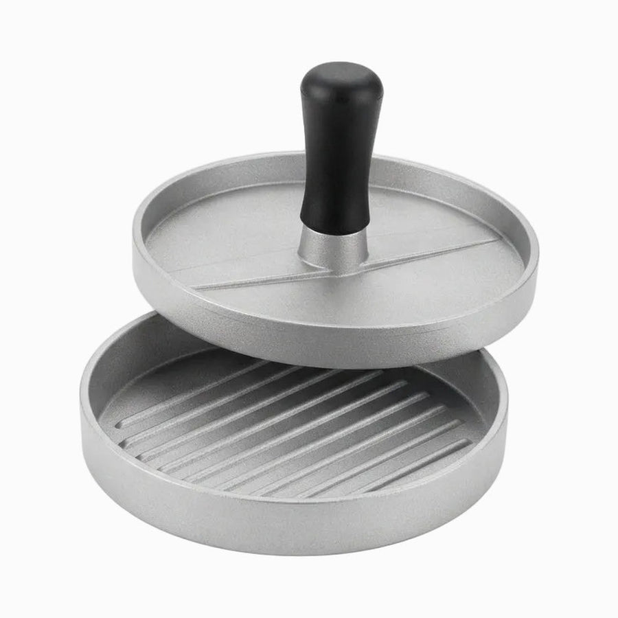 Burger press with black handle and ridged patty base, separated