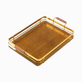Burnt bamboo serving tray with gold metal rails and wooden handles