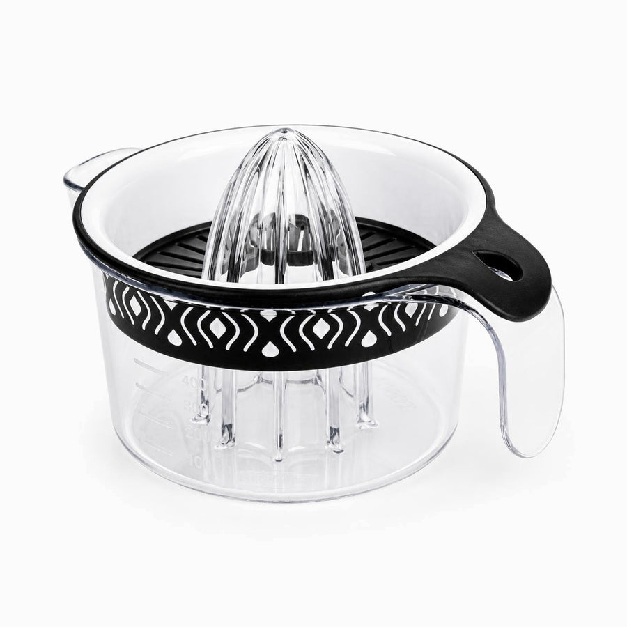 Black plexi citrus juicer with clear ribbed reamer, white bowl and black patterned band on a 400ml measuring jug