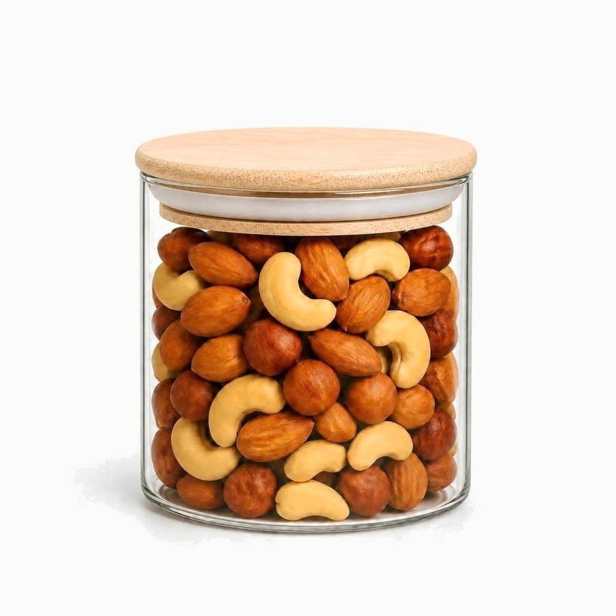 Round Glass Storage Jar with Airtight Bamboo Lid 10x10cm filled with mixed nuts