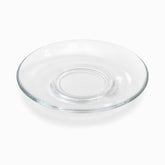 Single round clear glass saucer with sloped rim and raised ring around the center well
