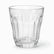 Close-up of a clear flared paneled tea glass with long panels and multi-sided base