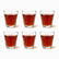 Flared Paneled Tea Glasses Set of 6 120ml, six clear flared glasses filled with red tea in 2 rows