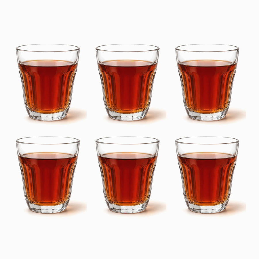 Flared Paneled Tea Glasses Set of 6 120ml, six clear flared glasses filled with red tea in 2 rows