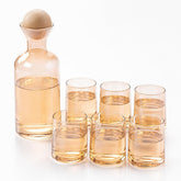 Warm gold tinted glass carafe with pale wooden ball stopper and 6 tapered tumblers