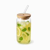 Can-shaped 550ml glass cup with bamboo lid and bent glass straw filled with mint lemonade