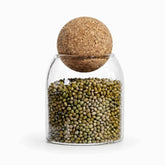 10 x 10 cm glass storage jar with cork ball lid filled with mung beans