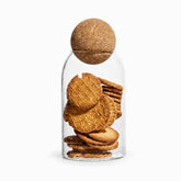 10 x 15 cm glass storage jar with cork ball lid holding round biscuits