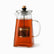 Glass Teapot with Stainless Steel Infuser 1.5L filled with black tea, steel lid with wooden knob