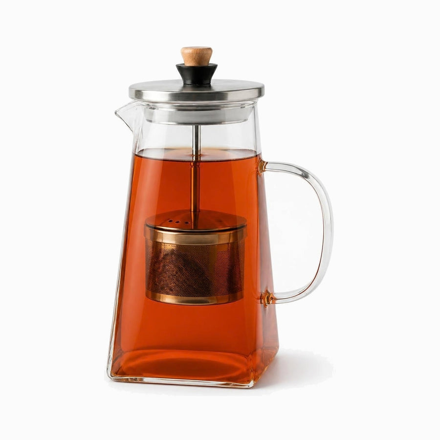 Glass Teapot with Stainless Steel Infuser 1.5L filled with black tea, steel lid with wooden knob