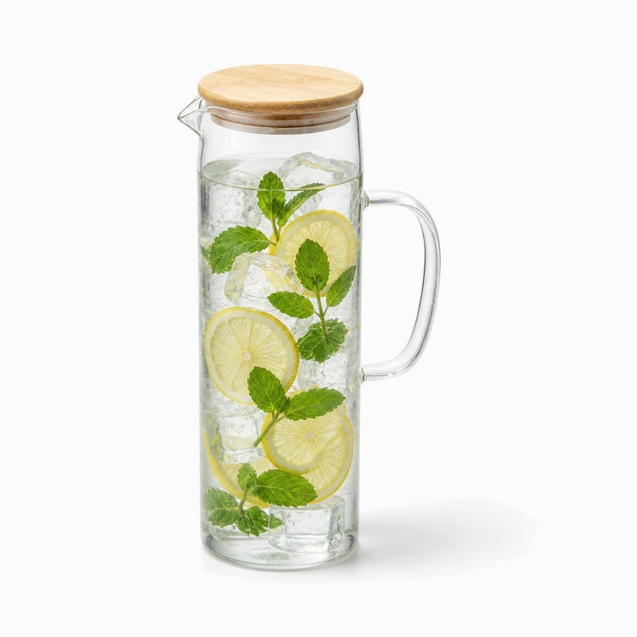 1.5L tall glass water jug with bamboo lid filled with lemon slices, mint and ice
