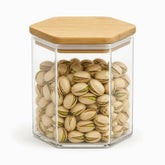 Hexagonal glass jar with bamboo lid, 10x10cm, filled with pistachios