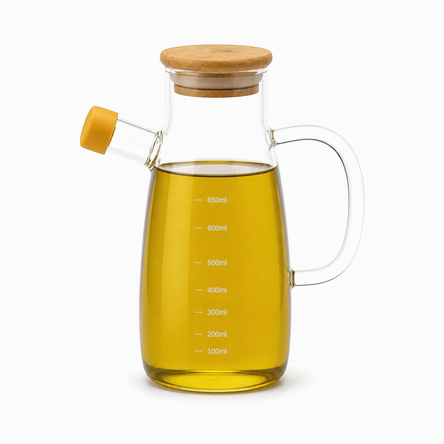Glass olive oil jug filled with olive oil, bamboo lid, yellow spout cap and grey ml marks up to 650 ml
