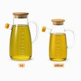 Glass olive oil jugs side by side in 1 L and 650 ml sizes
