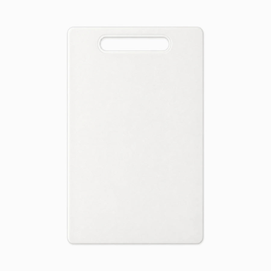 White plastic cutting board with handle slot and rounded corners, top view