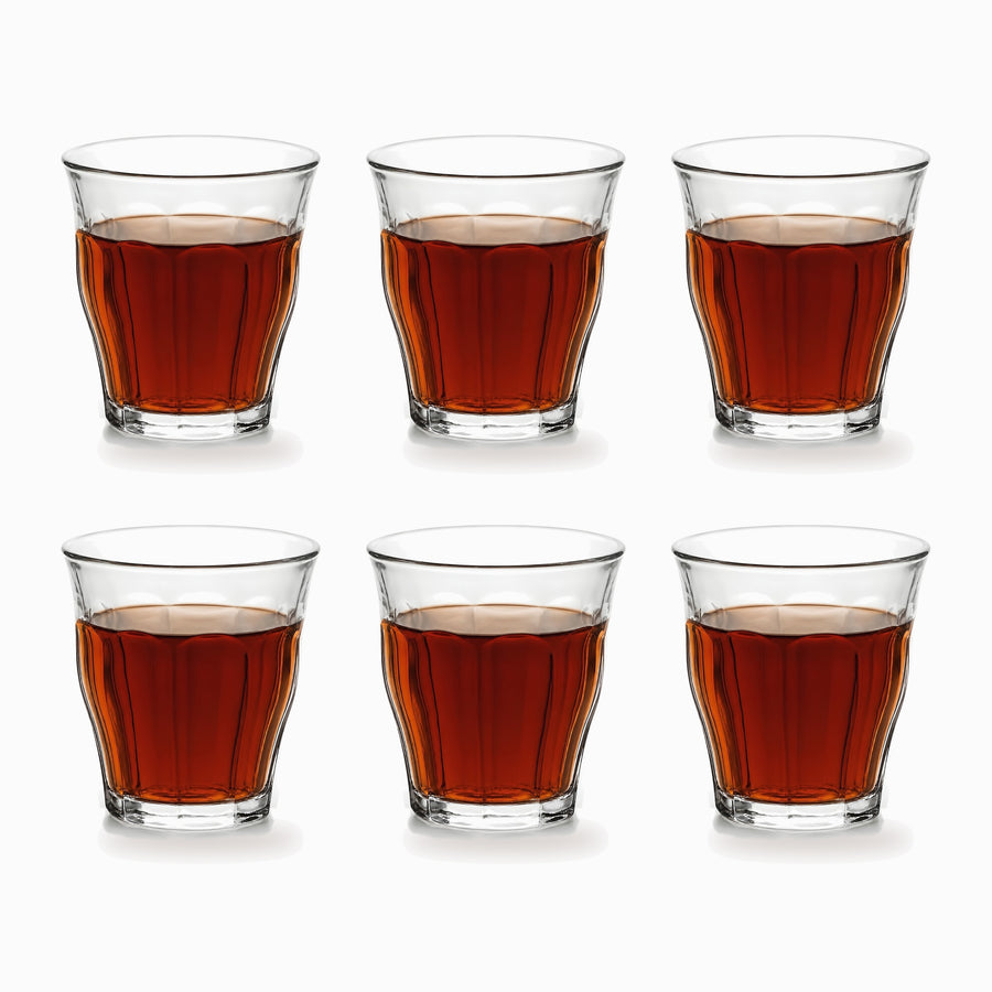 Paneled Tea Glasses Set of 6 95ml, six clear paneled glasses filled with red tea in 2 rows