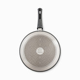 Bottom of a granite crepe pan with stainless steel induction base and Phoenix stamp
