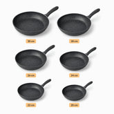 Six Phoenix granite frying pans lined up from 30 to 20 cm with size labels