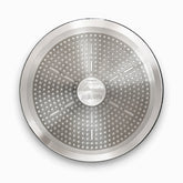 Bottom of a granite round pan with stainless steel induction base and Phoenix stamp
