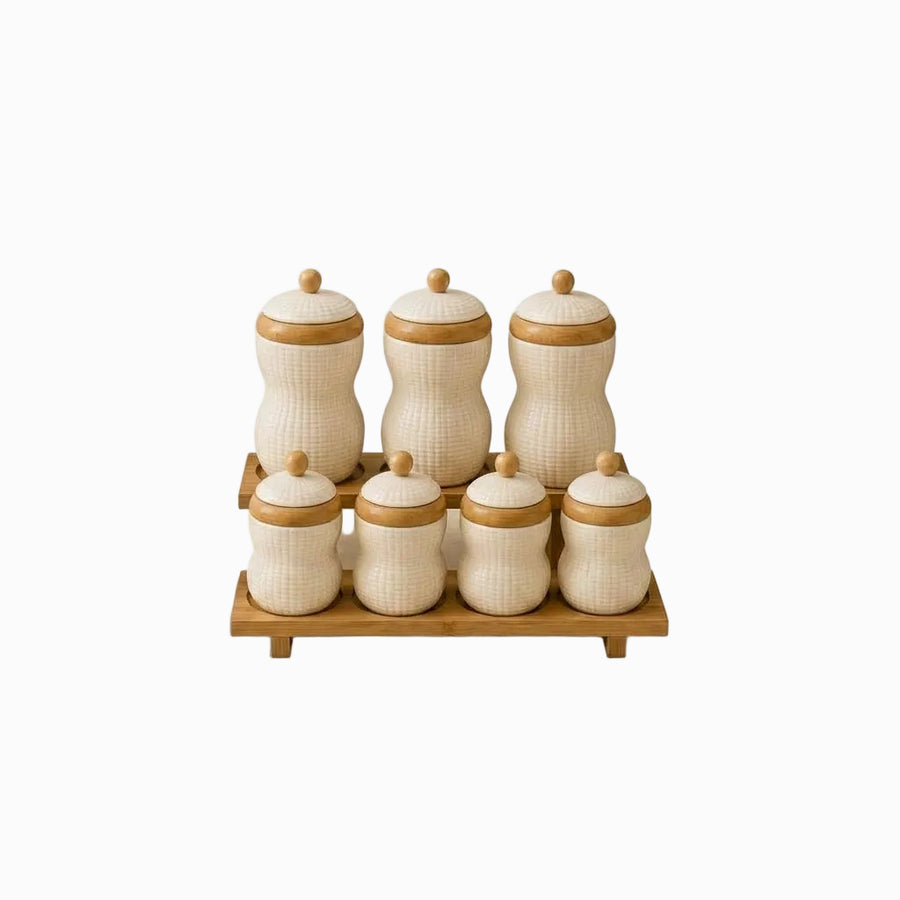 Porcelain Canisters with Bamboo Lids & Rack - 7 cream textured canisters on a bamboo stand