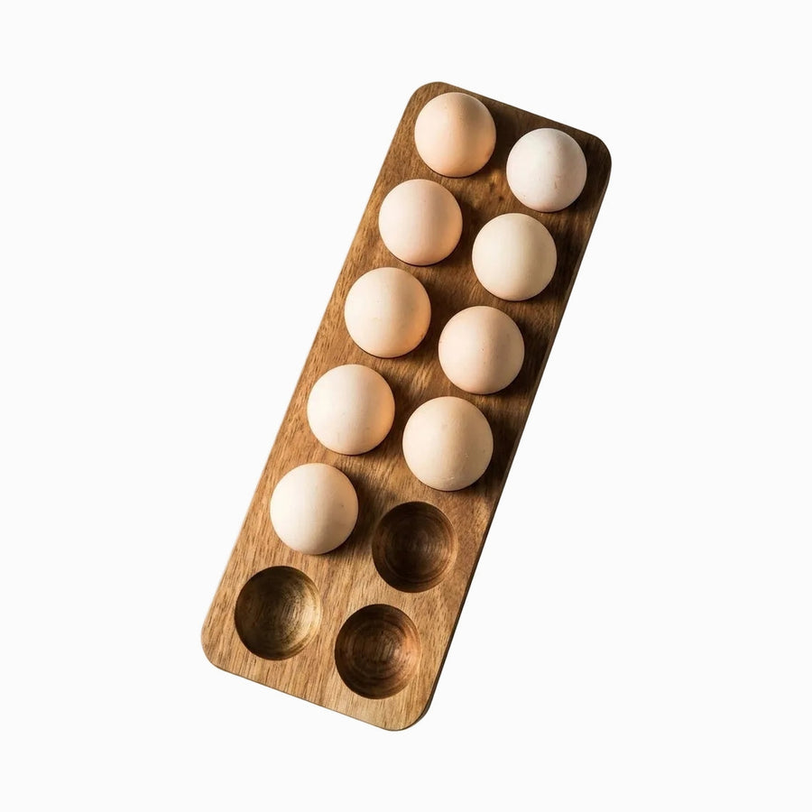 Rectangular acacia wood egg tray with 12 holes holding brown eggs