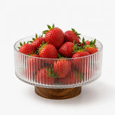 Small ribbed glass bowl on acacia wood base, 15cm, filled with strawberries