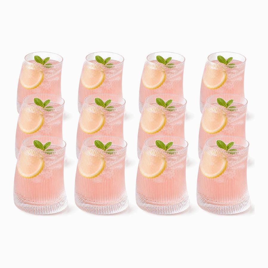12 short curved ribbed glasses with rose-water lemonade, lemon and mint, in 3 rows