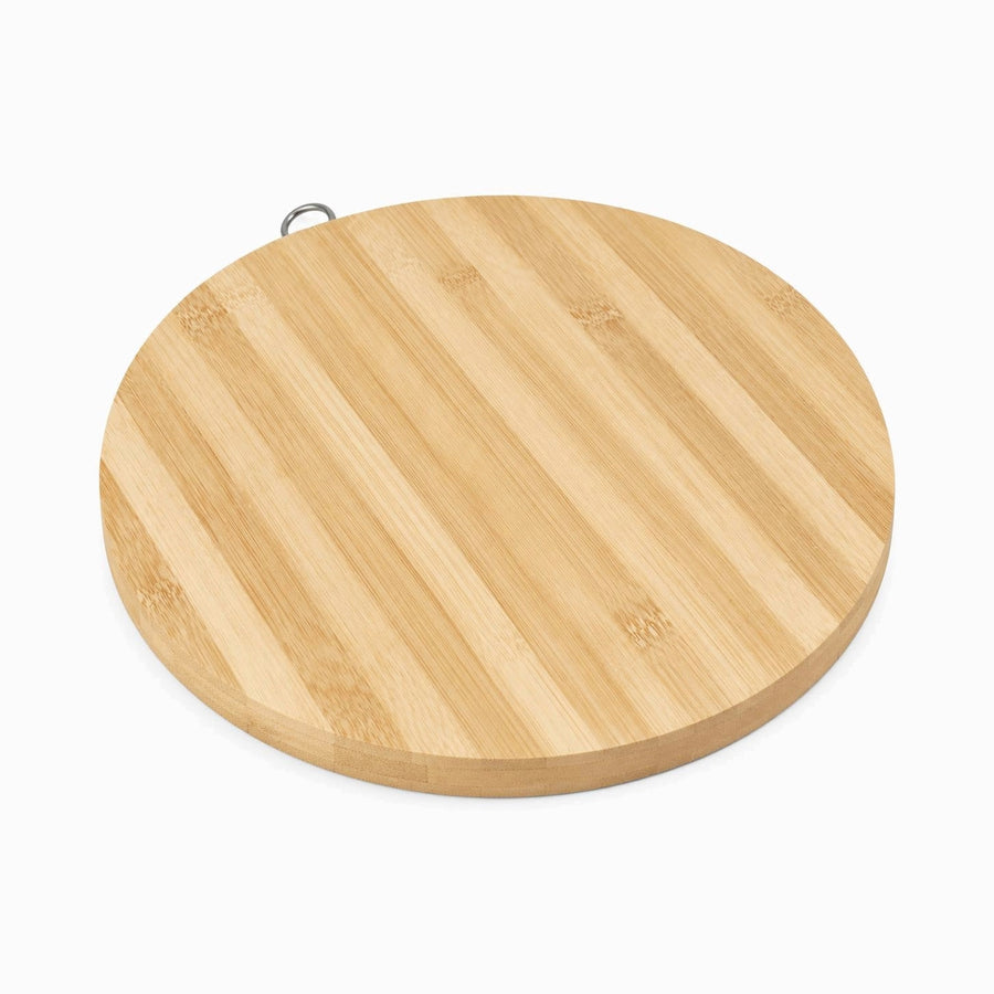 Round bamboo cutting board with metal hanging ring, angled view