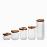 Set of 5 empty ribbed glass jars with burnt wood lids in 5 sizes
