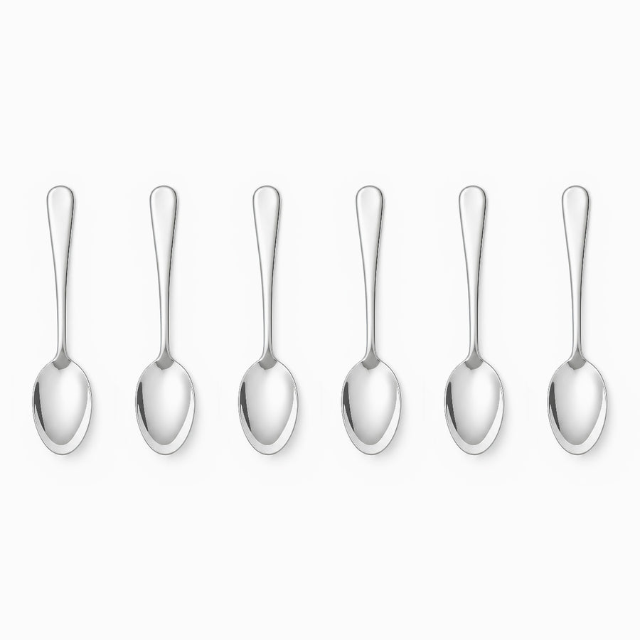 Six mirror-polished stainless steel coffee spoons lined up in a row