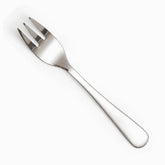 Single mirror-polished stainless steel dessert fork with plain rounded handle, diagonal view