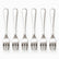 Six mirror-polished stainless steel dessert forks with 3 tines lined up in a row