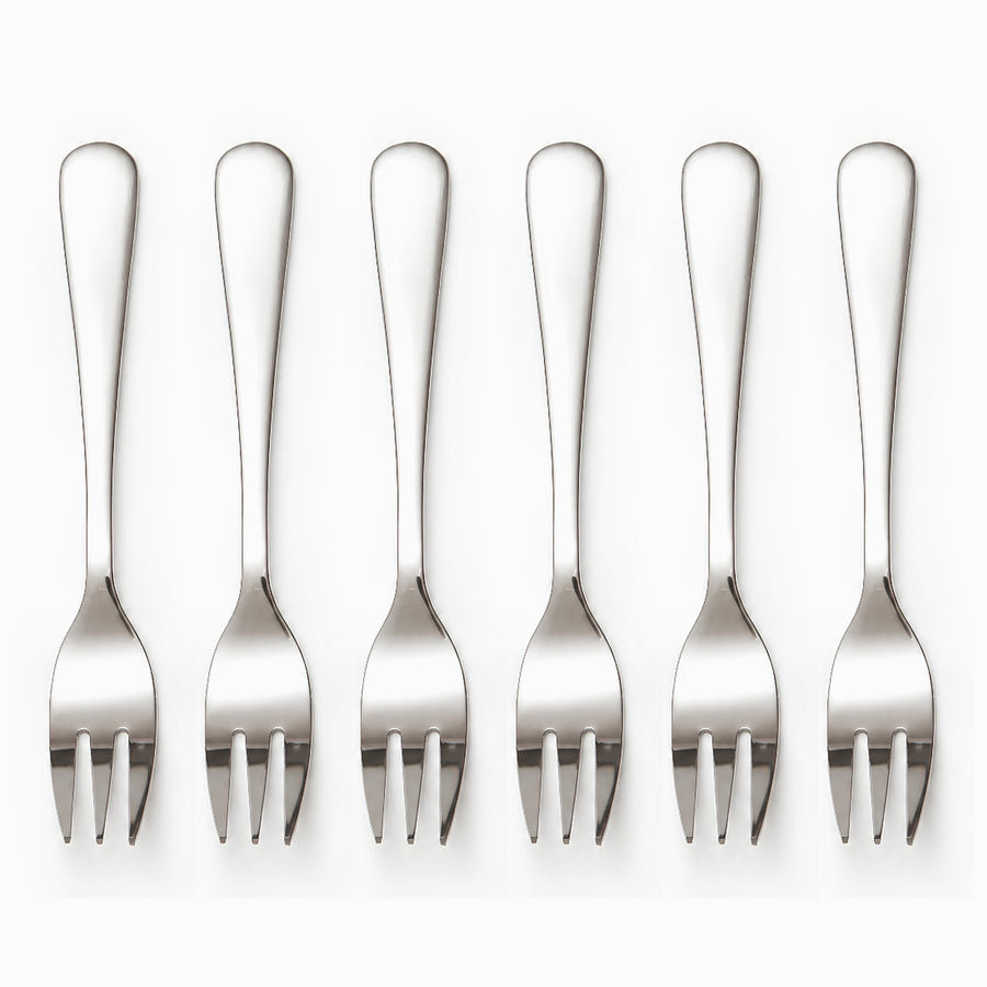 Six mirror-polished stainless steel dessert forks with 3 tines lined up in a row