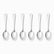 Six mirror-polished stainless steel dessert spoons lined up in a row