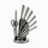 6 stainless steel knives, sharpening steel and black-handled scissors on a round rotating stand