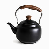Small matte black teapot with wooden knob and wooden grip handle