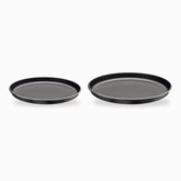30 cm and 35 cm graphite Tramontina pizza pans side by side to compare sizes